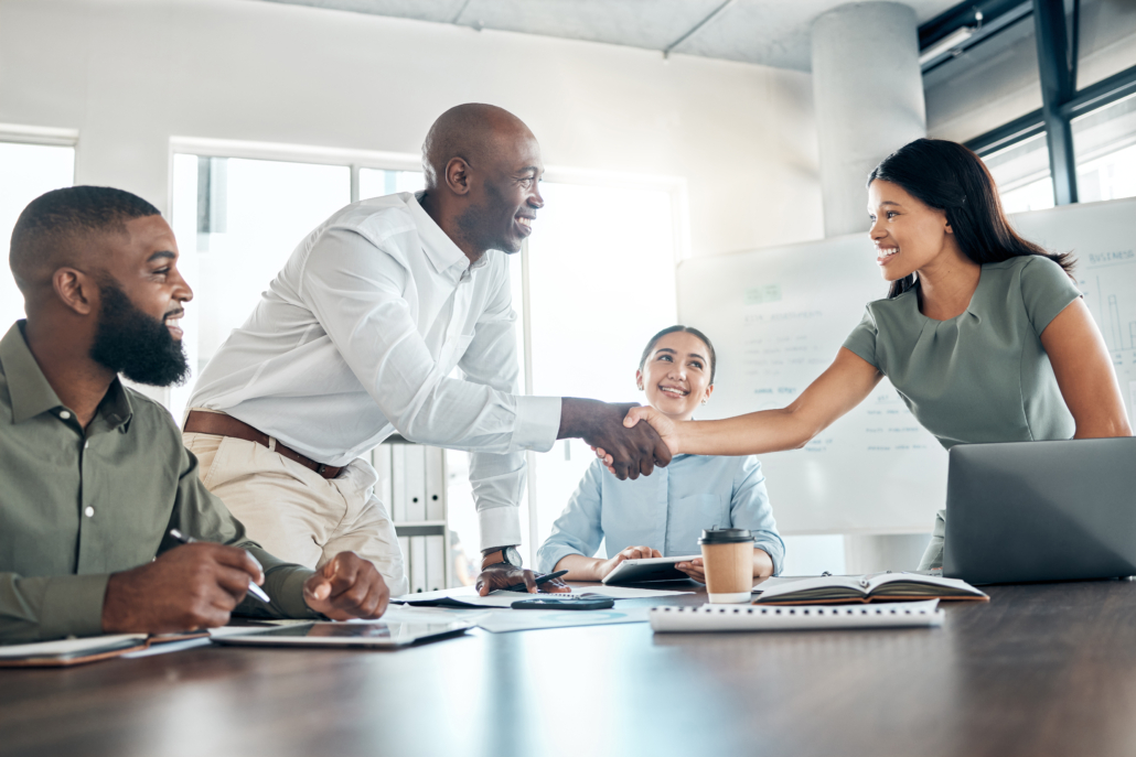 Handshake, office diversity and meeting welcome for company onboarding or partnership together. Introduction, agreement and negotiation with workforce people in corporate company boardroom